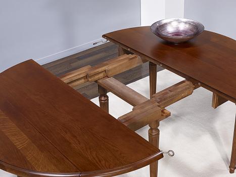Table ronde à volets Vera réalisée en Chêne Massif de style Louis XVI avec  3 allonges de 40 cm