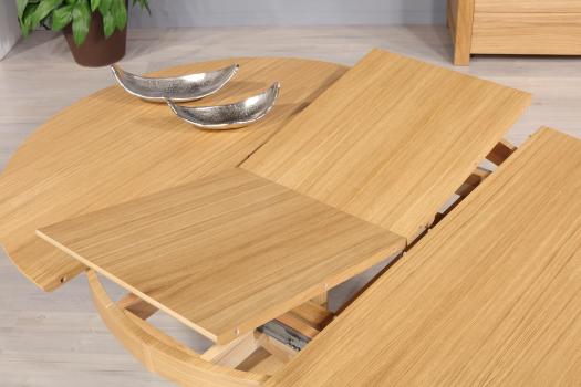 Table ronde Contemporaine Romain, diamètre 120 cm réalisée en chêne avec un pieds central et 1 allonge portefeuille de 50 cm 